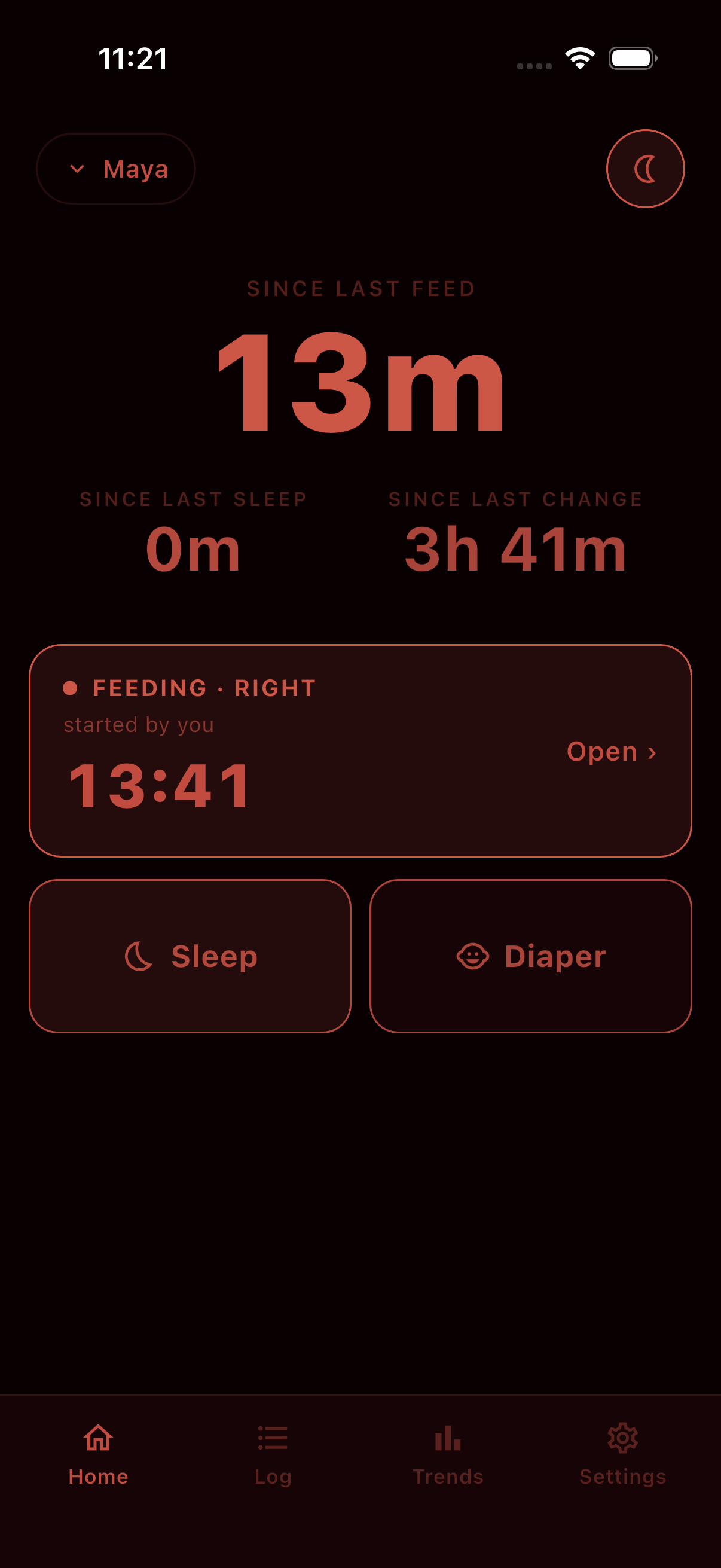 The Village home screen in the deep-red Nightshift theme built for 3am: the same one-thumb feed, sleep and diaper logging rendered in low-glare red on near-black.